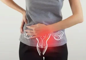 Woman holding her lower abdomen reflecting pain and metabolic symptoms of PCOD and PCOS