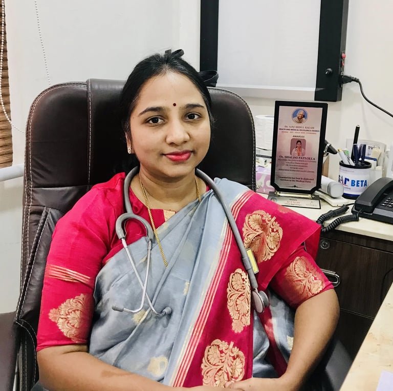 Dr. Shalini Patlolla sitting at her clinic desk